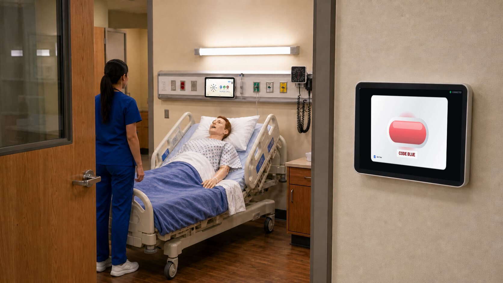 A hallway Door Alarm displaying Code Blue outside a simulation room